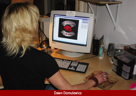 Custom Graphic Designer, Dawn Domulewicz at her Adobe Workstation